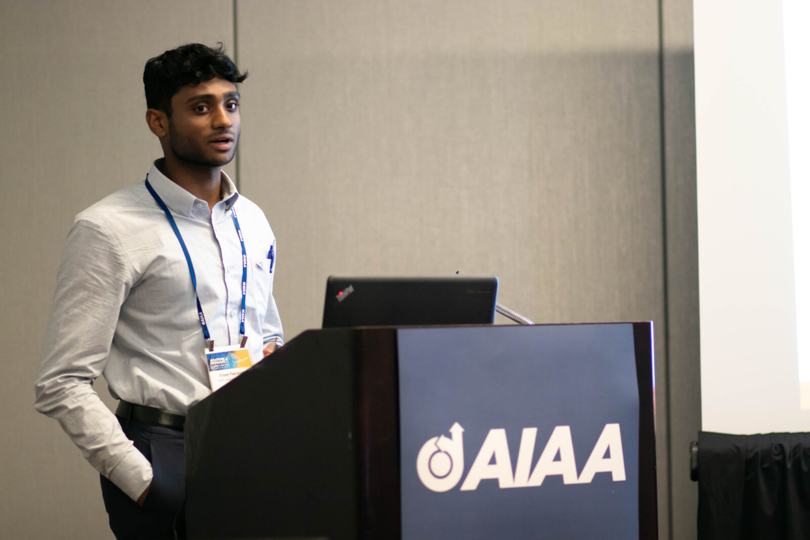 undergraduate presenting at a conference
